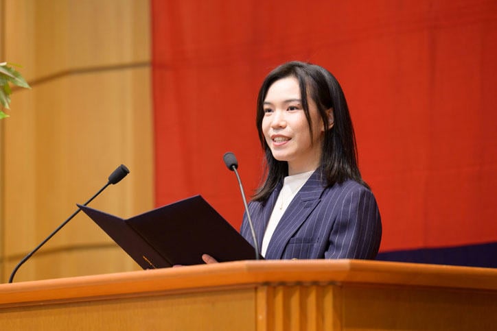 Ysanne speaking as student representative at Keio University